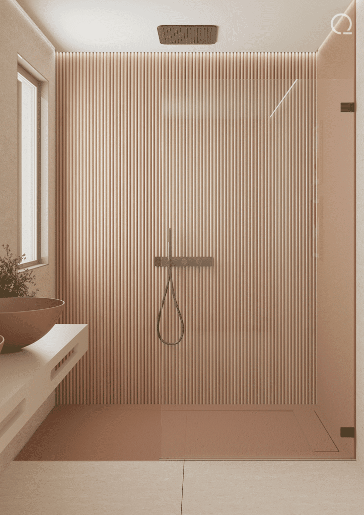 Spacious glass-enclosed shower from Quare with fluted tiling, exemplifying modern luxury bathroom design.